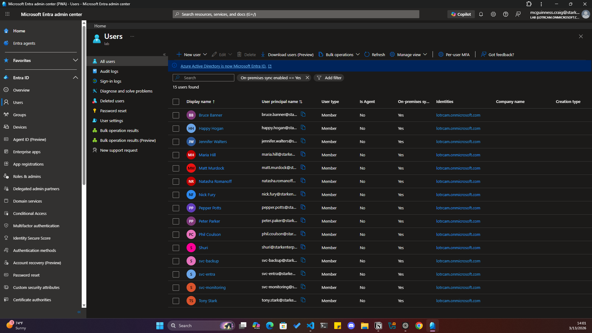Microsoft Entra ID user list showing on-premises sync enabled status for hybrid users
